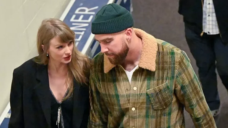 Travis Kelce, Taylor Swift during an event. - X