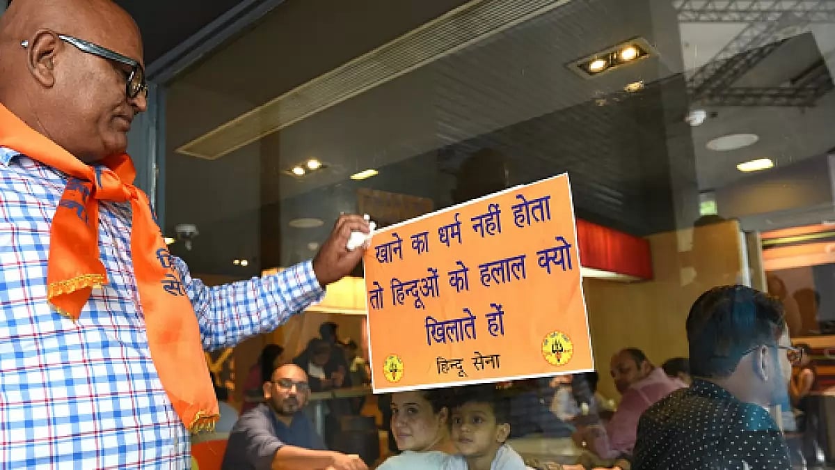  Hindu Sena activists stick posters during a protest (representative image) 