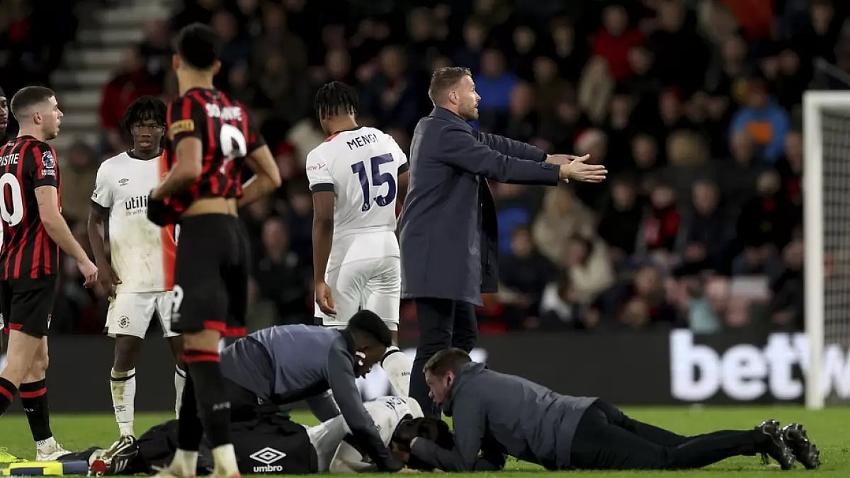 Luton Town's Tom Locker receives treatment on the pitch