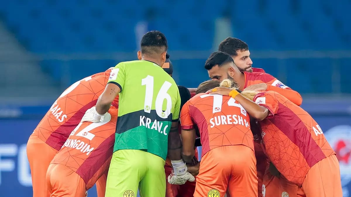 Punjab FC players in a huddle before the match against Kerala Blasters FC in Indian Super League 