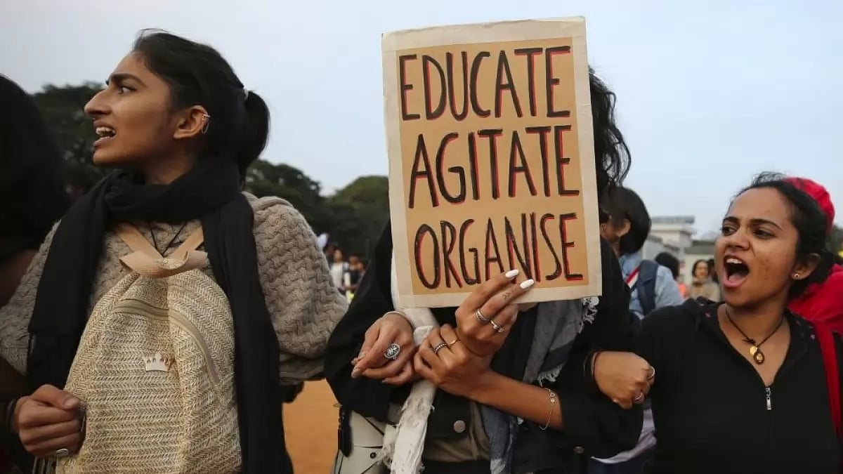 Students in Bangaluru shout slogans against Citizenship Amendment Act and hold placards during a protest march