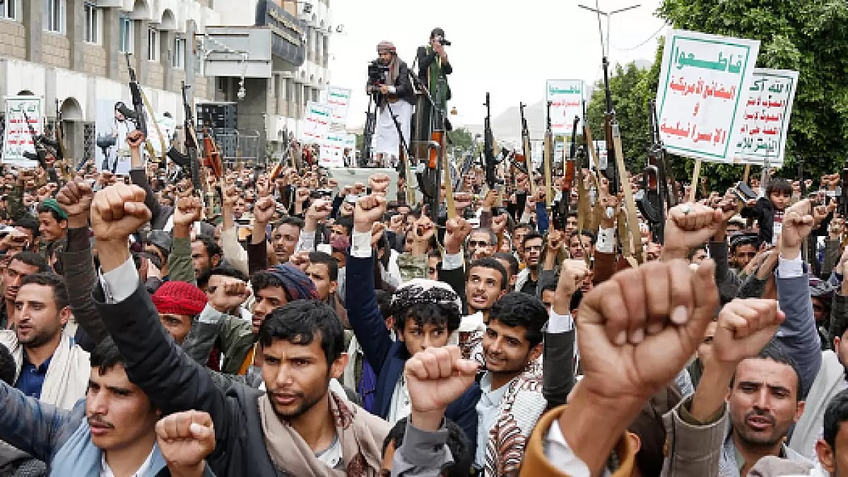Houthi supporters chants slogans on the street - null