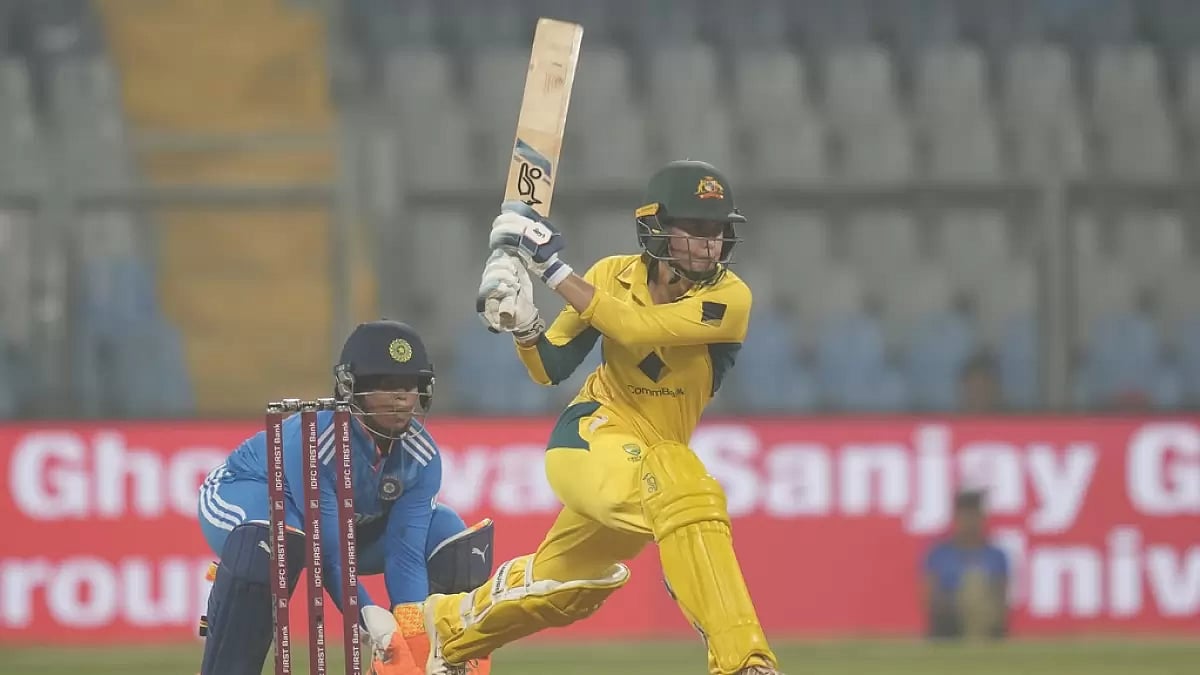 Phoebe Litchfield (R) plays a shot during the first ODI between India and Australia in Mumbai.