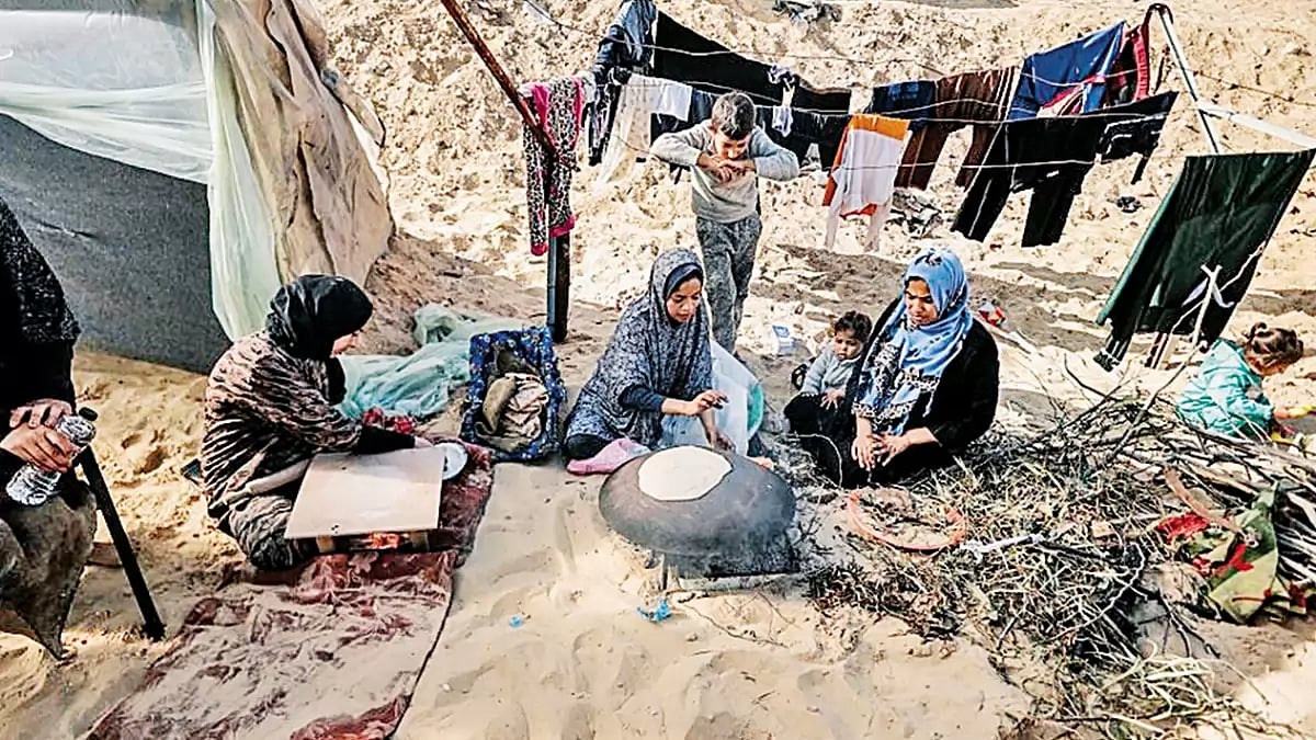 Food Crisis: A displaced Palestinian family living in a makeshift camp in southern Gaza without water, electricity and enough food.
