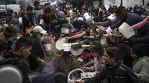 Palestinians converge for a free meal in Rafah, Gaza Strip, Thursday, Dec. 21, 2023