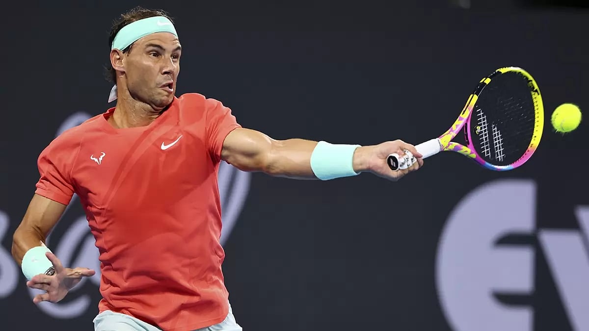Rafael Nadal hits a return against Jason Kubler of Australia during the Brisbane International tennis tournament.