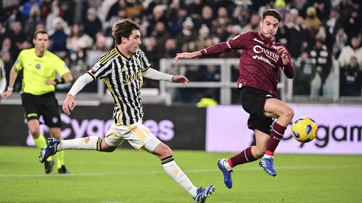Fabio Miretti, left, scores during the Italian Cup football match between Juventus and Salernitana at the Juventus Stadium in Turin, Italy.