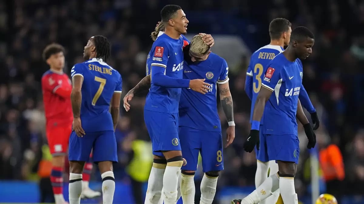 Enzo Fernandez, third right, celebrates with teammates after scoring his side's fourth goal during the English FA Cup football match between Chelsea and Preston North End at Stamford Bridge stadium in London.