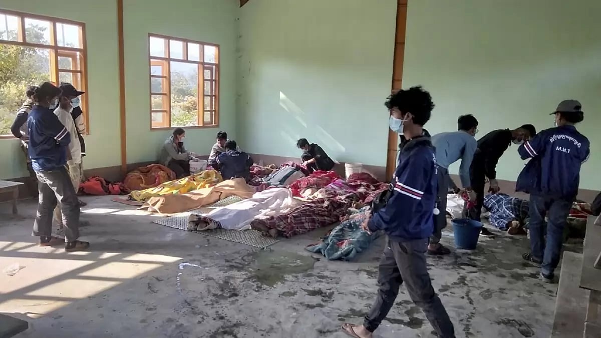 People clean the victims of airstrikes