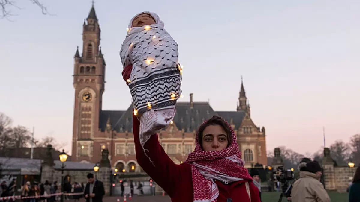 Protestor outside ICJ, in Hague