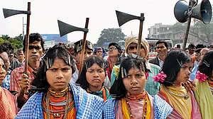 Tribal people dance in protest against the poor implementation of the Forest Rights Act in Bhubaneswar in 2016