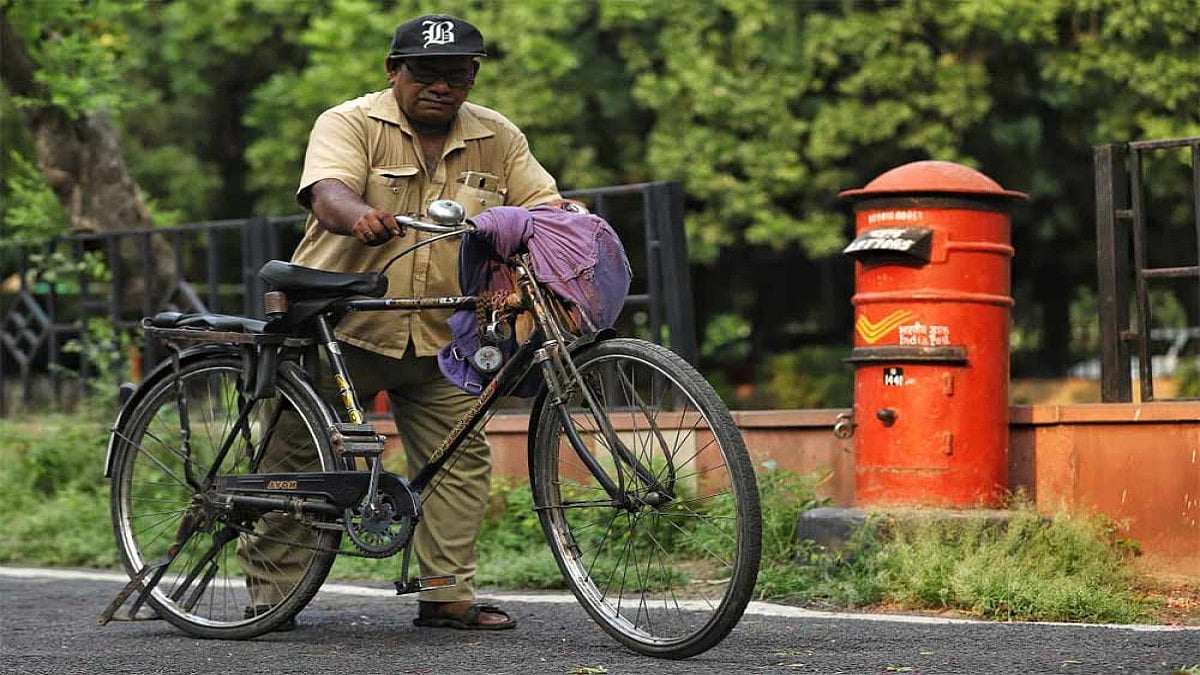 A postman delivering postal mails