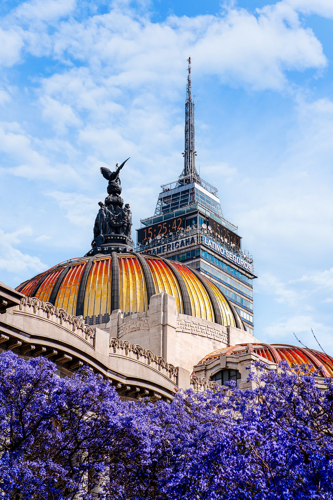 Palace of fine arts with the Latin American tower in spring, jacarandas