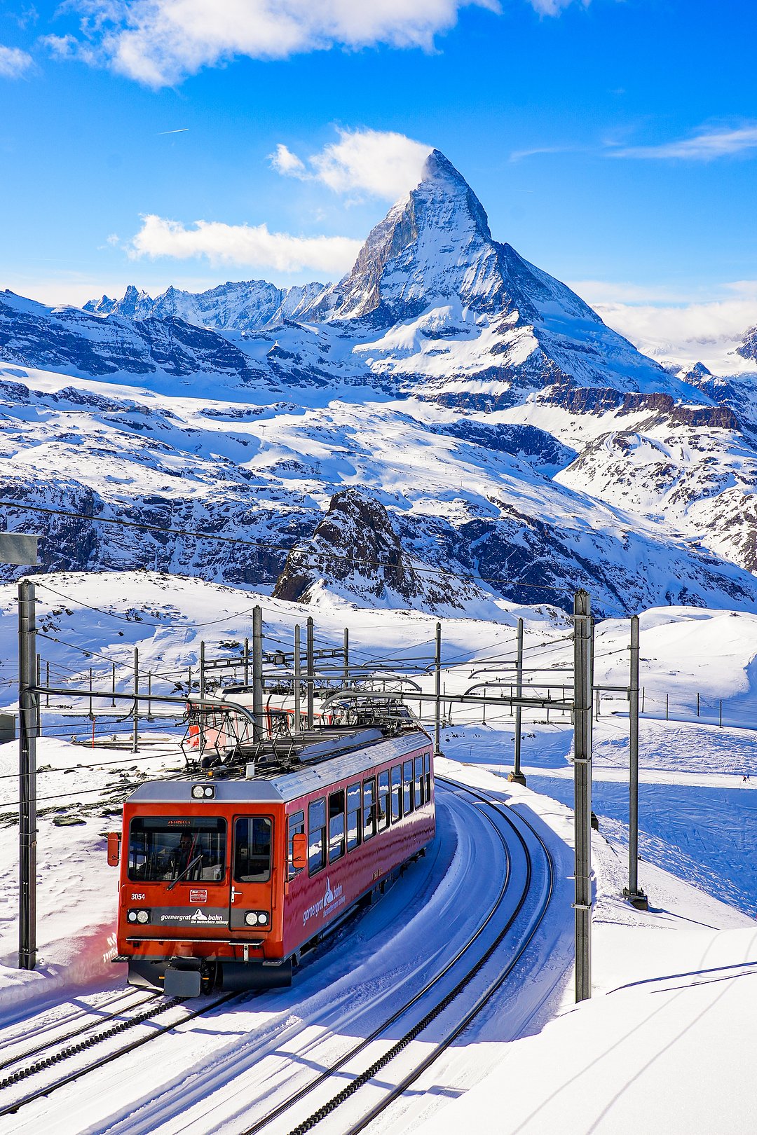 Cogwheel train of the Gornergrat Railway climbing the mountain facing the Matterhorn above Zermatt