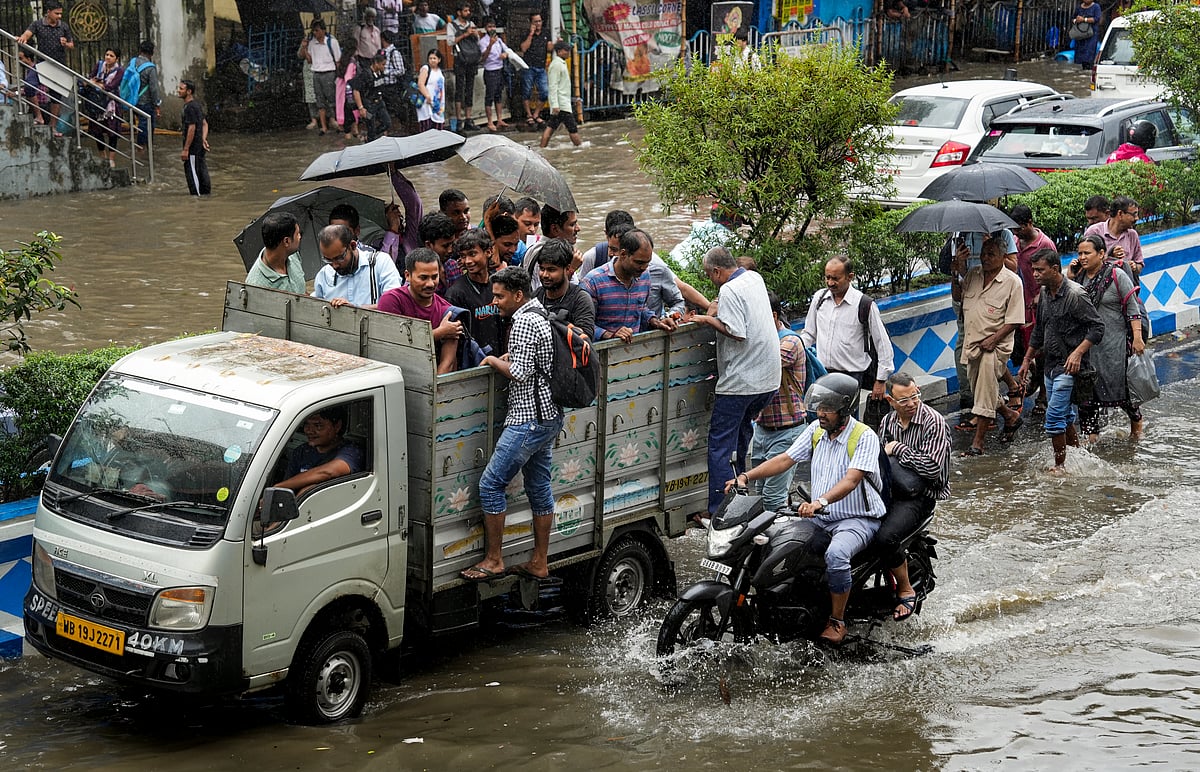 PTI  : The heavy downpour left streets waterlogged, vehicles stranded, and people wading through waist-deep, muddy water 