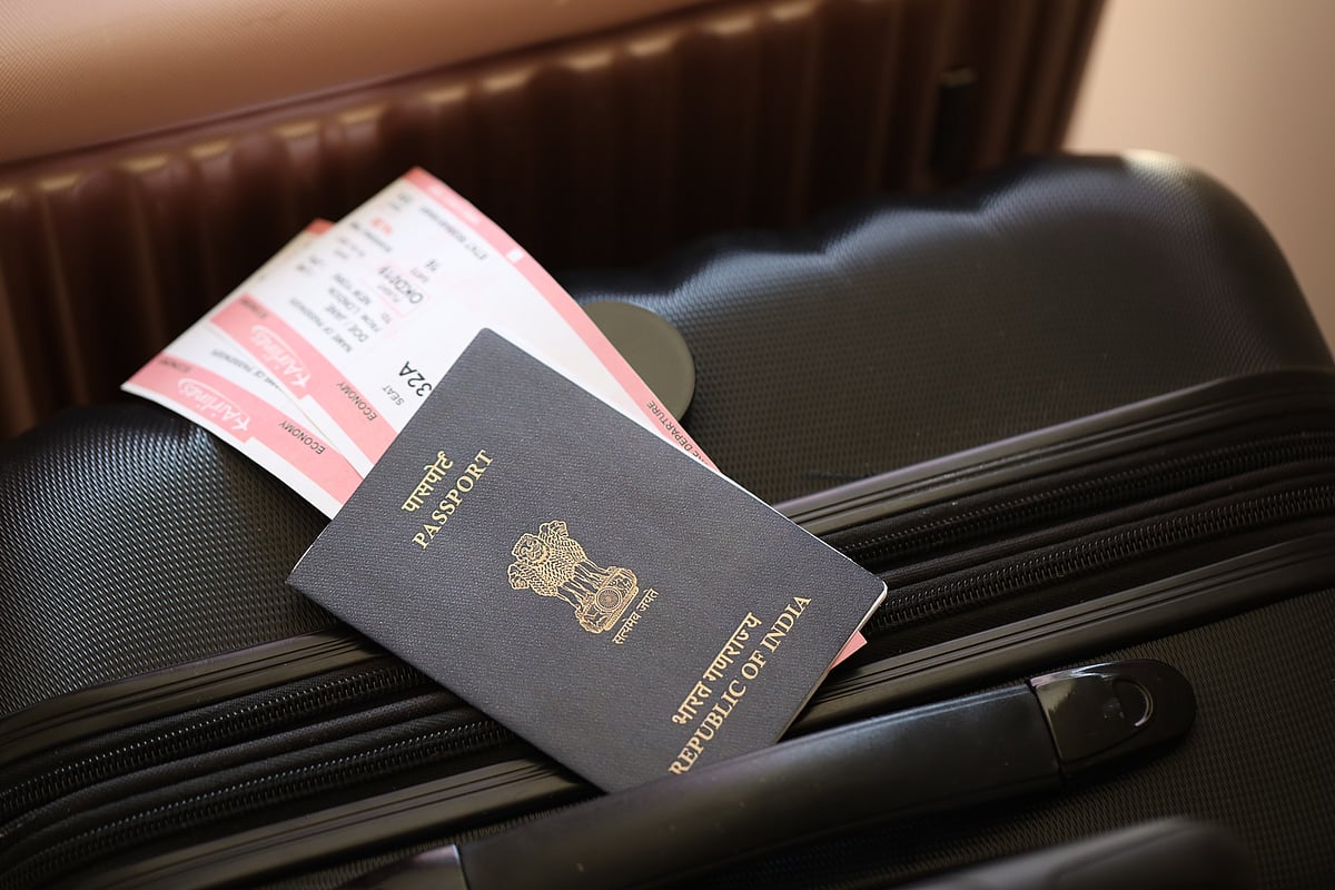 Shutterstock : Indian passport with boarding pass