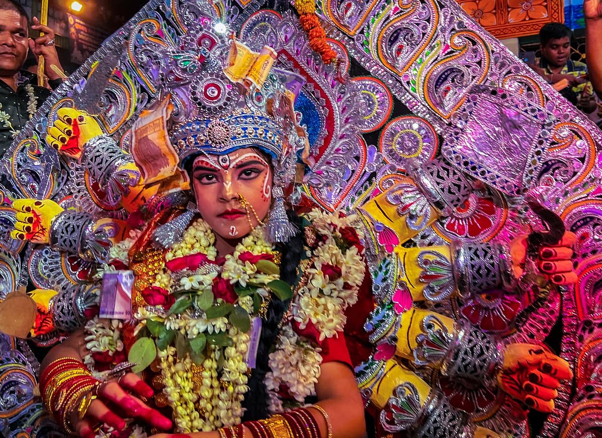 Debmalya Das  : Dashabujha Durga Medho where young girls get dressed as Goddess Durga and perform on the streets