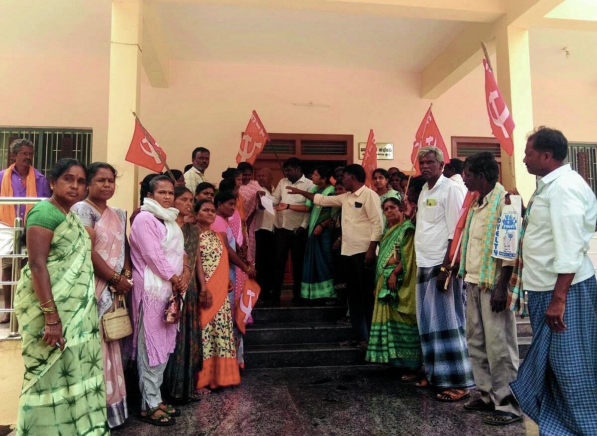 Labor unions protest outside MLA's office in Pavagada