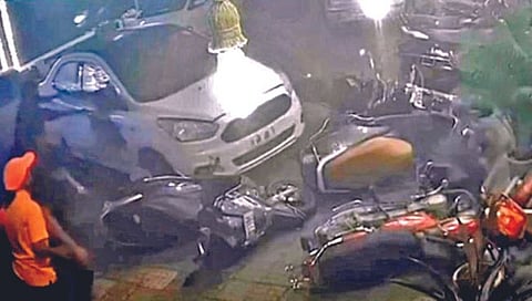 A drunken driver vandalized a two-wheeler in front of a hotel with a car