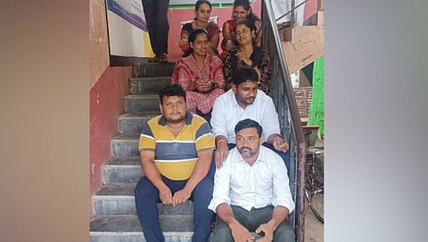Gram Panchayat Members stand on the steps of Gram Panchayat
