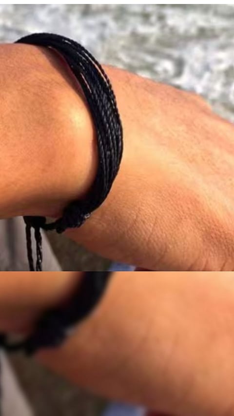 Should a black thread be tied on the hand or on the foot? Does this have any benefits? 