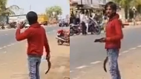 கையில் அரிவாளுடன் நிற்கும் 
பிரவீன் 