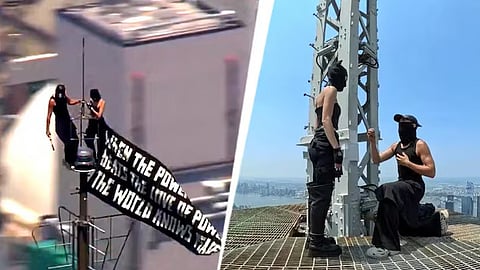 Russian couple climb to top of US NYC Empire State Building