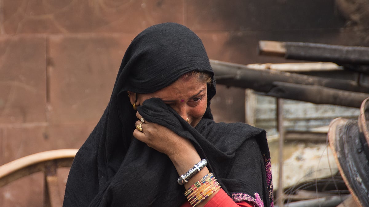 دہلی فسادات کی متاثرہ / Getty Images