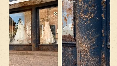 Bröllopsglädje förbyttes i bajschock när en bomb, fylld med avföring, exploderade utanför butiken. 