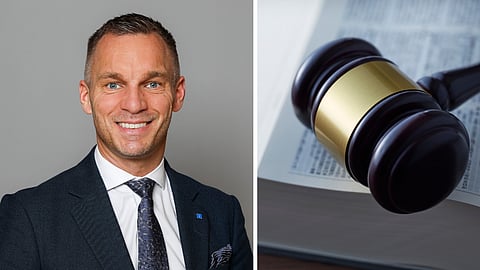 Bild på Civilminister Erik Slottner och en lagbok