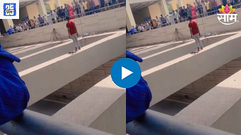 Youth climbs bridge