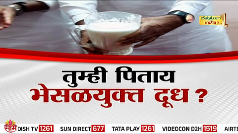 MLA Gopichand Padalkar demonstrates fake milk preparation using lime and oil in Vidhan Bhavan, Mumbai.