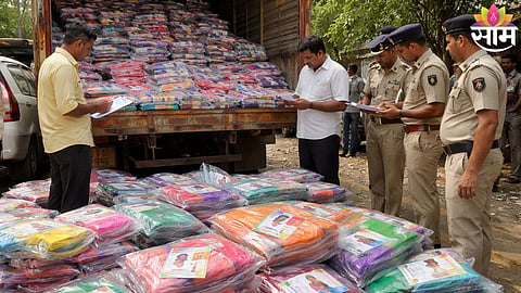 Flying squad officials inspecting seized sarees allegedly meant for voter inducement ahead of ZP elections in Kolhapur.