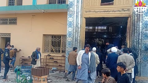 Rescue teams inspect the damaged structure of a Shia mosque after a deadly suicide bombing in Islamabad, Pakistan.