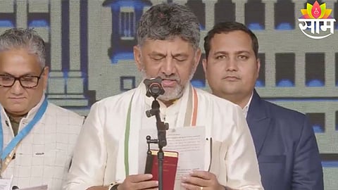 DK Shivakumar takes oath as the new Chief Minister of Karnataka during a grand ceremony at Lok Bhavan Glass House.