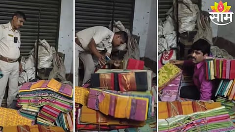 Police pull out TMC leader Brahmanand Chakraborty from beneath saree bundles during a raid in Howrah.