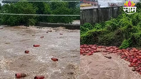 LPG cylinders seen floating in the Patalganga River after floodwaters damaged an HPCL plant wall in Raigad.