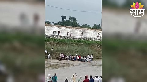 Villagers swim to safety after an overloaded boat capsized in the Bagmati River in Bihar’s Sitamarhi district.