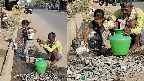 ജലക്ഷാമത്തെത്തുടര്‍ന്ന് റോഡരികിലുള്ള വെള്ളം ശേഖരിക്കുന്ന അച്ഛനും മകളും

