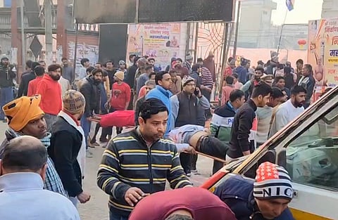 Injured devotees being taken for treatment after a watchtower collapsed during 'Laddu Mahotsav',