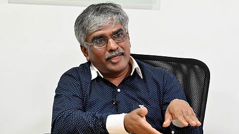 Dr. BAIJU