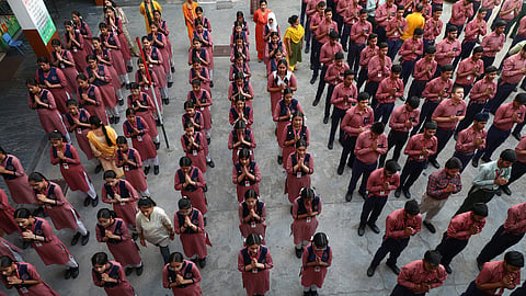 Students attend a prayer meet at a school
