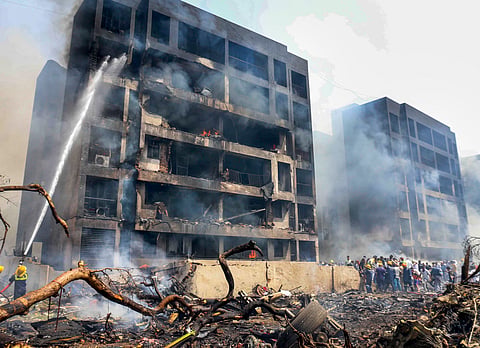 Firefighting team at the spot after an Air India plane crashed moments after taking off from the Ahmedabad airport, 