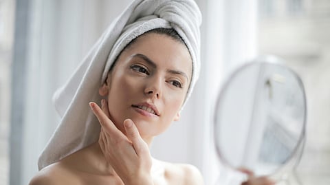 Photo of Woman Looking at the Mirror