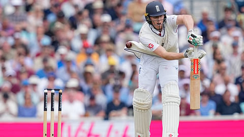England's batter Zak Crawley gets hit by the ball 