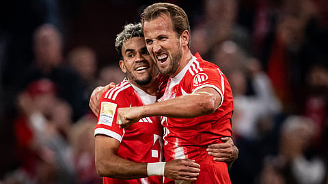 Harry Kane celebrates a goal with Luis Diaz