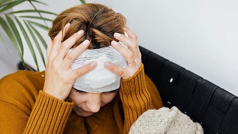 Woman having Head Injury