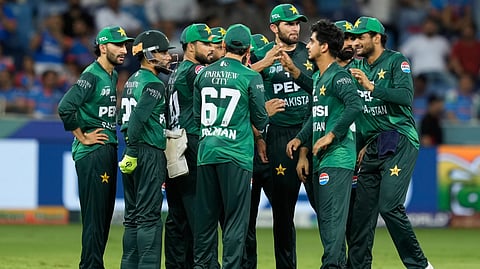 Pakistan's Saim Ayub, third right, and teammates celebrate the dismissal of India's Abhishek Sharma 