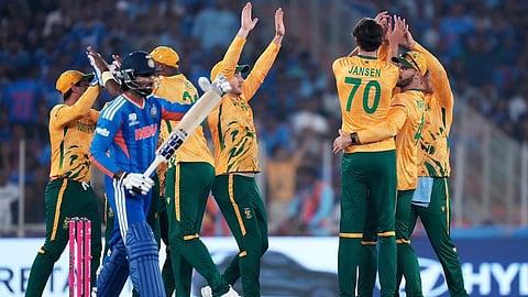 South Africa's Marco Jansen, back to the camera, celebrates with teammates the wicket of India's Tilak Varma