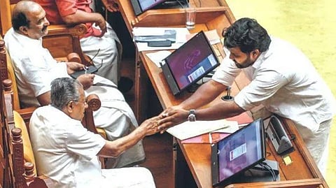 A D Thomas shakes hands with Pinarayi Vijayan